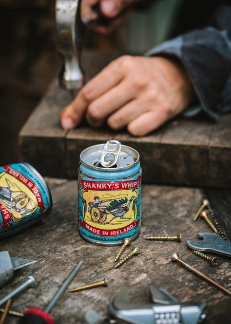 Shanky's Whip cans on a workbench