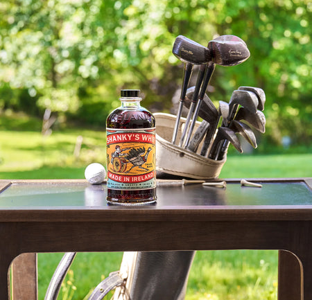 Shanky's Whip bottle on the golf course